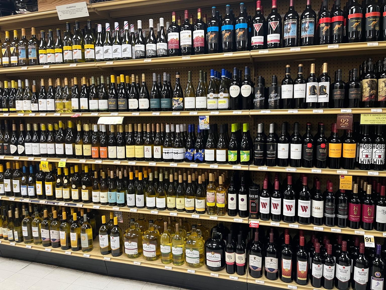 Wall of wine bottles on shelves inside Stanley's Liquor & Wine in Jackson